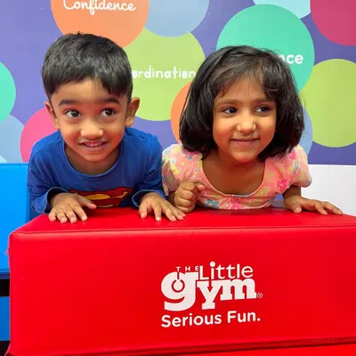 The curious and happy faces of two friends enjoying their time at the gym. These moments of shared fun are what our parties are all about.