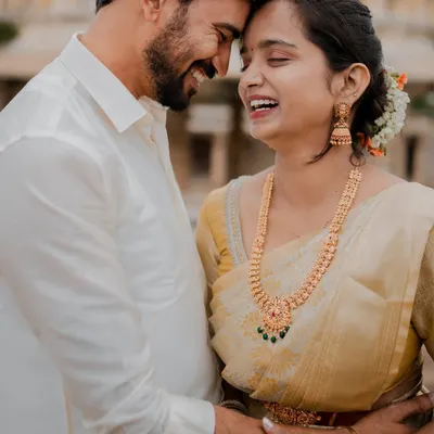 A moment of pure joy and laughter at the historic Melkote temple. The ancient stone pillars provide a stunning backdrop for this couple's modern love story.