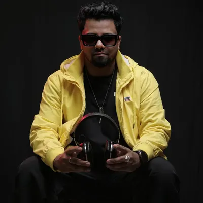A professional shot from a photoshoot. I believe in presenting a stylish and confident image that reflects the quality and energy of my performances.