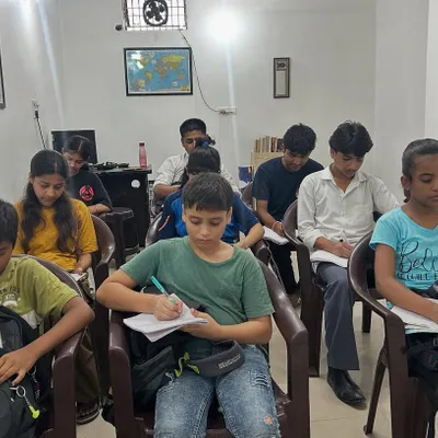 A typical day at the academy where students are concentrating on a test. I ensure the environment is quiet and conducive to deep work, helping them build the discipline required for high school and college-level studies.