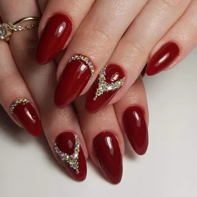 A classic and elegant bridal look featuring deep red gel polish on almond-shaped extensions. You will learn precise rhinestone placement techniques to create beautiful, durable patterns like these.
