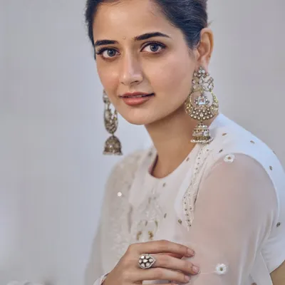 A beautiful portrait of actress Ashika Ranganath wearing my off-white chikankari georgette Anarkali. It features delicate self-pearl and mixed embroidery with a classic bandhgala neckline for a look of pure grace.