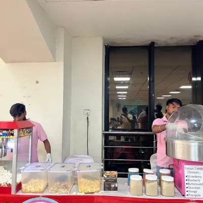 For kids' parties, we can set up fun food stations like this popcorn and cotton candy counter. This was a big hit at a 5th birthday party we catered.