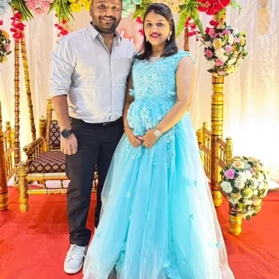 The perfect "Cinderella" moment for a baby shower. This mom-to-be looks absolutely radiant in a sky blue ball gown with delicate 3D floral appliques, ready to celebrate with her loved ones.