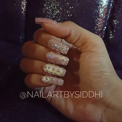 A full-on glamour set for a birthday celebration, featuring square-shaped nails completely covered in sparkling Swarovski crystals.