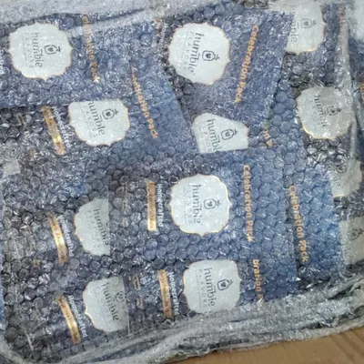 This is what a large corporate order looks like before it heads out for delivery. Here you can see hundreds of pouches of my Fusion Cocoa Balls, all carefully bubble-wrapped to ensure they arrive safely. Fulfilling these large orders is a challenge I truly enjoy.