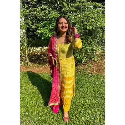 My Diwali look, featuring a bright yellow and pink bandhani suit. I love playing with vibrant colors and traditional prints for festive occasions.