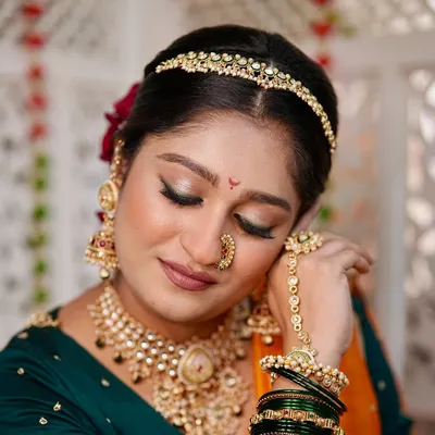 A modern fusion look that unites tradition with artistic elegance. Here, I paired a soft, shimmery eye with a matte lip to complement the bold colors of her outfit and the contemporary jewellery.