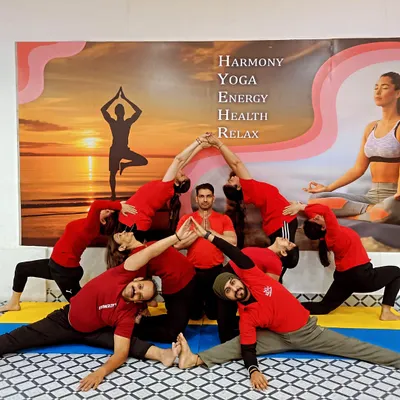 Here we are exploring a creative group formation in our Acro Yoga class. This practice is a beautiful way to build connection and achieve poses you never thought possible.