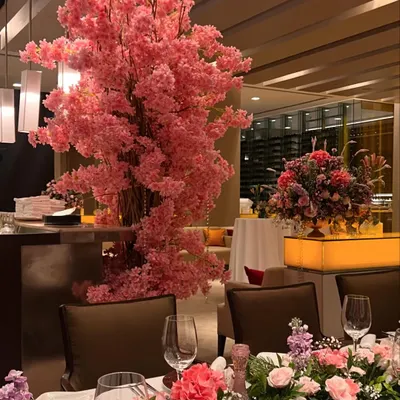 We created a dreamy pink floral escape at The Oberoi, Mumbai. The centerpiece of the room was a magnificent, life-sized pink cherry blossom tree that added a touch of magic and romance to the intimate dinner setting.