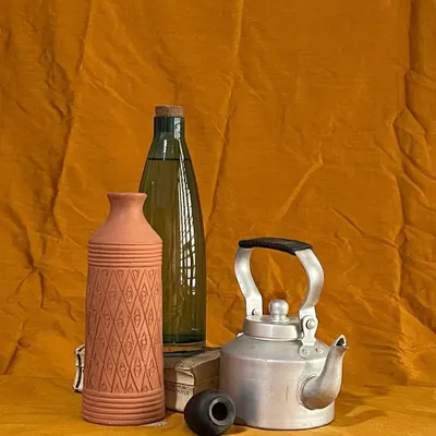 A still life arrangement prepared for a drawing and painting class. We teach students to observe the interplay of light, shadow, texture, and reflection on different objects, a crucial step in creating realistic artwork.