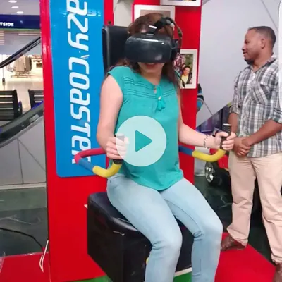 Here is one of our riders fully immersed in the Crazy Coaster VR experience. With the headset on and hands on the controls, she is navigating thrilling twists and drops, all while our motion-sync chair brings the virtual world to life. We are always on hand to ensure a safe and exciting adventure.