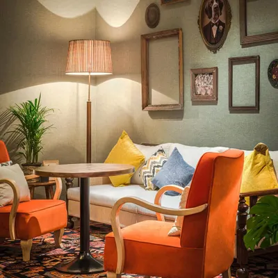 This restaurant and bar is a melange of individualistic spaces. A 30-foot tall library with a regal chandelier and spiral staircase creates a vintage vibe, while versatile seating and minimalist lighting evoke a sense of nostalgia and comfort.