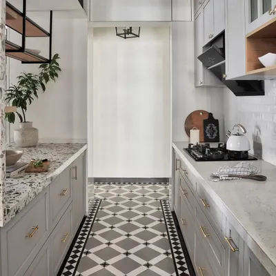 In this Mumbai apartment with Nordic design influences, the cement concrete finish tiles add a modern, rustic touch to the floors. They provide a contemporary backdrop for the shaker-style cabinets in a super matte grey laminate finish.