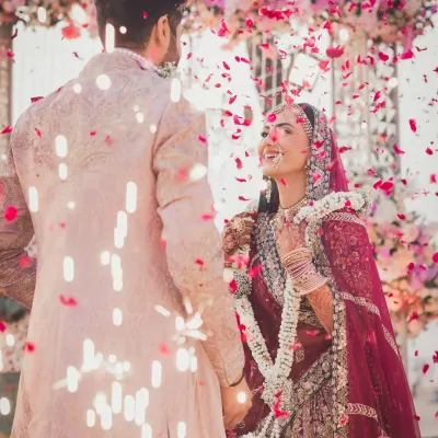 The moment of "I do," showered in a confetti of rose petals. This is the peak of joy, the beginning of forever for Bhavita and Neil, and we capture it in all its glory.