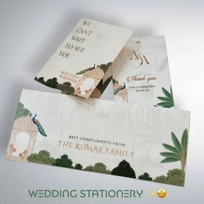When every detail matters, we create coordinated wedding stationery. This set includes custom-designed money envelopes, thank you tags, and key holders, all featuring a beautiful peacock and botanical theme to match the main invitation.