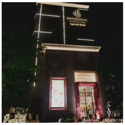 The grand facade of Batukbhai Jewellers in Nagpur, illuminated at night. Our architectural design aimed to create a landmark destination that communicates luxury and permanence, drawing clients in from the moment they arrive.