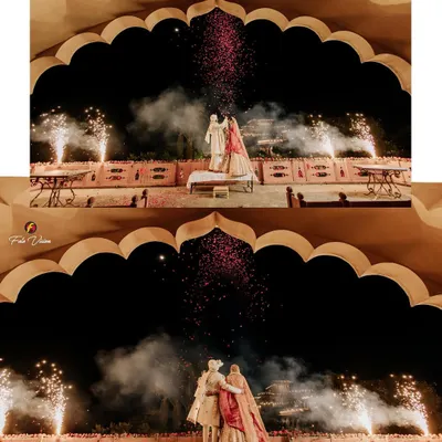 Dheemant and Geet's varmala ceremony framed by a stunning palace arch and illuminated by fireworks. We use architectural elements and dramatic lighting to create a sense of royal grandeur for your key wedding moments.
