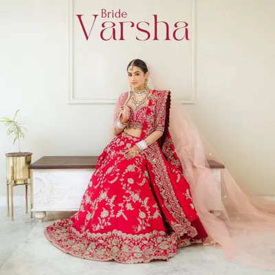 A bridal portrait that feels like a magazine cover. Varsha looks absolutely regal in her red lehenga, a perfect blend of modern style and timeless tradition.