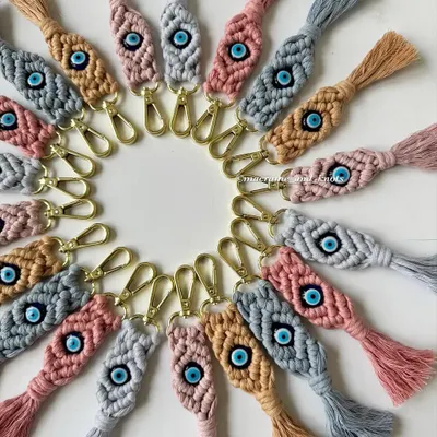 A closer look at the detail in my evil eye macrame keychains. The diamond knot pattern is woven tightly around the central bead, creating a beautiful and durable charm for your keys or bag.
