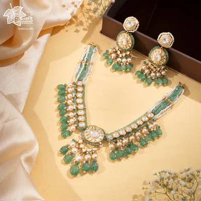 The Tourmaline Trail is a gentle river of gemstones. This set features pastel green tourmaline beads, lustrous pearls, and polki diamonds, flowing into a masterpiece of quiet sophistication and understated luxury.