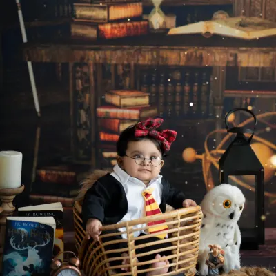 Platform 9¾ is calling! For the little wizard in your life, our Harry Potter themed shoot is a magical experience, complete with a Gryffindor tie, glasses, and a Hedwig look-alike.