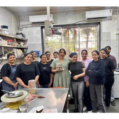 A happy moment with the whole Maska team celebrating my birthday in the kitchen. This is my family, and their dedication and joy are the secret ingredients in every cake we make.