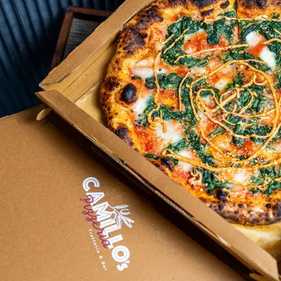 Sometimes the best seat in the house is your own sofa. I box up my pizzas straight from the oven, so you get that fresh, hot, and authentic trattoria experience delivered right to your door. This is comfort food, no fuss involved.