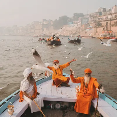 Three sadhus on a boat in the Ganga, surrounded by morning mist and migratory birds. It’s a classic Banaras scene, full of peace and a sense of timelessness.