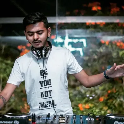 "Be you not them." This is a motto I live by. This photo captures me in my zone, focused on the music and staying true to my own style behind the decks.