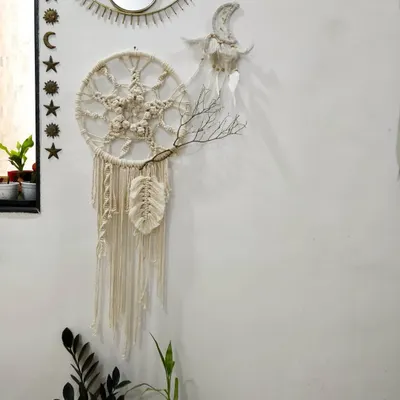 My dreamcatcher-inspired macrame wall hanging, styled in a cozy corner. I designed it to feel both intricate and natural, a piece of art that brings calm.