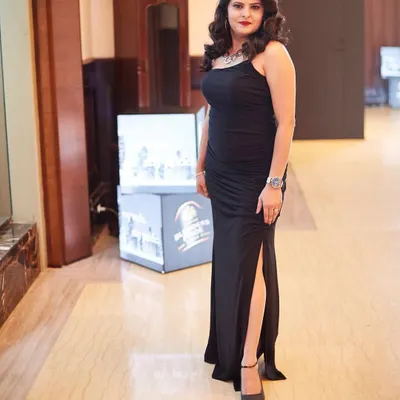 A classic black gown is a wardrobe essential. I designed this bodycon dress with a thigh-high slit for a formal awards night, proving that elegance is all about the right silhouette and a confident attitude.