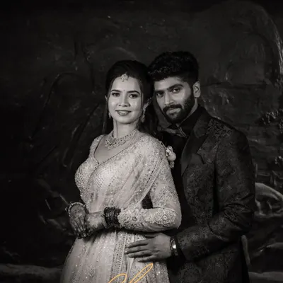 A classic black and white portrait that exudes timeless elegance. This reception shot highlights the couple's sophisticated style, proving that some moments are most powerfully captured in monochrome.