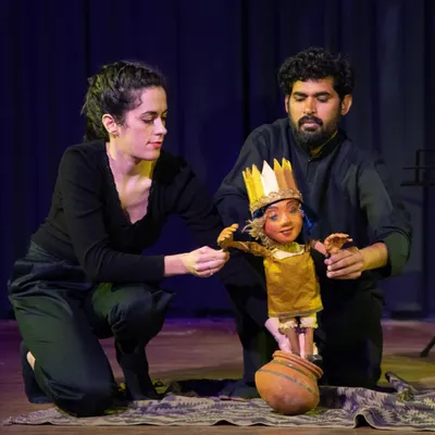 A dynamic scene from 'Buried Treasures' where our French and Indian artists interact with a puppet. This moment highlights the show's blend of live acting and puppetry to tell stories in a fresh, engaging way.
