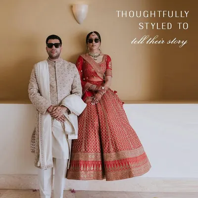 Two souls, one style story. For this couple, we paired a classic red Sabyasachi lehenga with a refined Anita Dongre sherwani, creating a look that is both traditional and powerfully modern.