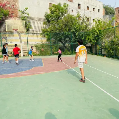 Our Juniors team during a practice game, learning the fundamentals of teamwork and court positioning.