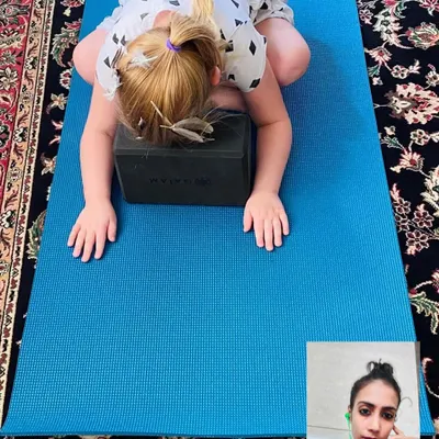 A snapshot from an online kids' yoga class, where my young student from Paris is practicing Child's Pose. We use props and creative cues to make yoga fun and accessible, helping children find calm and focus no matter where they are.