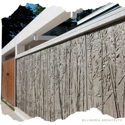 This exterior wall features a custom-designed, board-formed concrete texture with a bamboo motif. This technique transforms a simple boundary wall into a piece of art, adding a unique, tactile element to the architecture.
