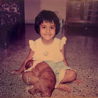 Let's get reacquainted! This is me as a little girl. I've loved dogs for as long as I can remember. In this post, I share a few random facts about myself, including my personal health journey and my dog Panty and cat Chaddi.