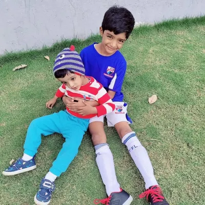 How it started. A beautiful moment between two brothers, with the older one, a long-time BYFL player, welcoming his little brother to the academy.