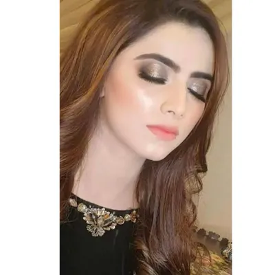 A perfect example of a pearly, shimmery eye makeup look. The metallic sheen on the eyelids creates a glamorous and eye-catching effect, ideal for evening events.