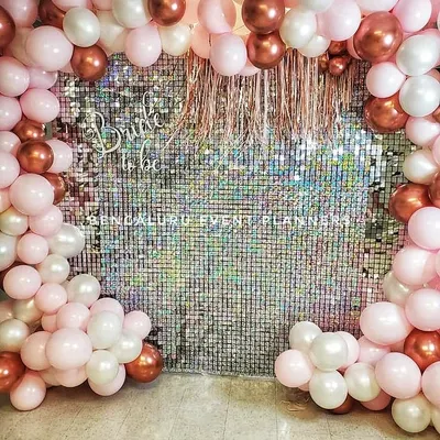 Here is a trendy and fun 'Bride to be' decoration I put together for a bridal shower. The shimmering sequin wall provides a glamorous photo backdrop, framed by a custom balloon arrangement in pink, white, and rose gold.
