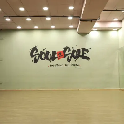 Our main studio space, featuring our signature logo wall. This versatile space is perfect for dance practice, workshops, and photo shoots.