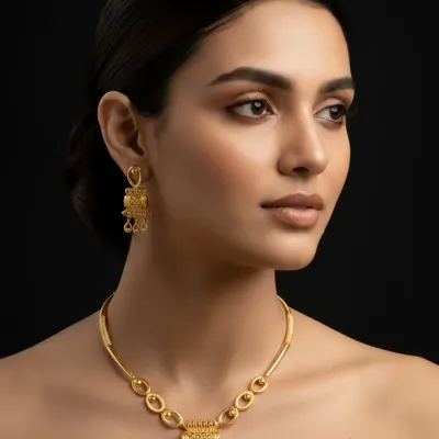 A model wears one of our premium gold necklace and earring sets, showcasing its elegant drape and heritage-inspired design. This piece blends traditional motifs with a modern silhouette, making it a versatile addition for any occasion.