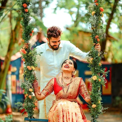 A beautiful, happy moment on a floral swing from a unique Mantra Mangalya wedding.