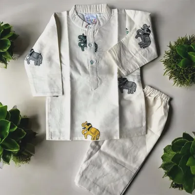 I love adding playful details to my boys' outfits. This off-white cotton kurta set features cute little embroidered elephants, making traditional wear fun for your little man. It’s simple, soft, and perfect for any celebration.