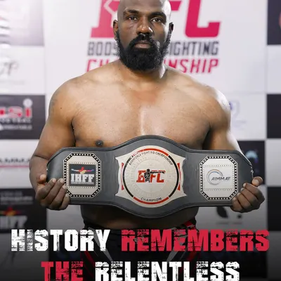 History remembers the relentless. This is me with the BFC championship belt, a symbol of the hard work and dedication I bring to my own training and to every fighter at my club.