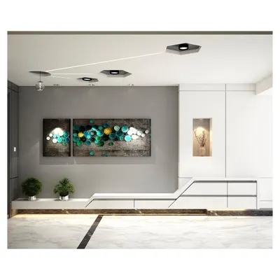 The living area of a luxury apartment, designed with a neutral palette and a recurring hexagonal geometry. The space features custom low-height storage and integrated ceiling lights that connect different zones.