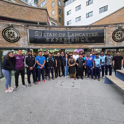 The team being hosted for a meal at the 'Sultan of Lancaster' restaurant. The Munshi family has graciously hosted our academy every year, giving the players a taste of home.