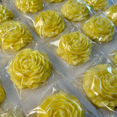 A handcrafted yellow peony soap, created as part of a return gift hamper, bringing a little sunshine to bath time.